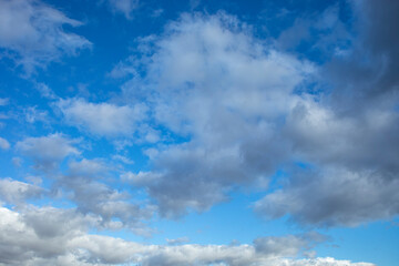 Detail of intense blue sky in broad daylight with fluffy white cumulus