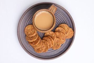 Tea and snacks pappdi or thattai a south Indian snack made from rice flour and dal