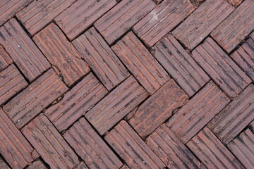 walkway is paved with brown bricks.