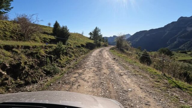 Get off the road recreation dirt road on top of the mountain POV. Nature, landscape and picturesque environment of mountains and forests. Outdoor fun, exploration and entertainment. Viewpoint.