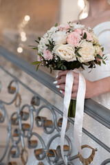 delicate wedding bouquet in the hands of the bride. idea for event agencies
