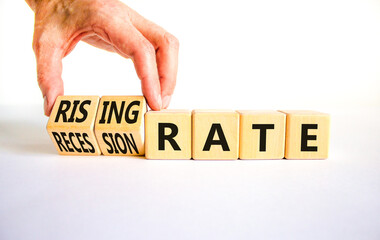 Recession or rising rate symbol. Concept word Recession rate Rising rate on wooden cubes. Businessman hand. Beautiful white table white background. Business recession rising rate concept. Copy space.