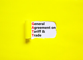 GATT symbol. Concept words GATT general agreement on tariff and trade on white paper on beautiful yellow background. Business GATT general agreement on tariff and trade concept. Copy space.