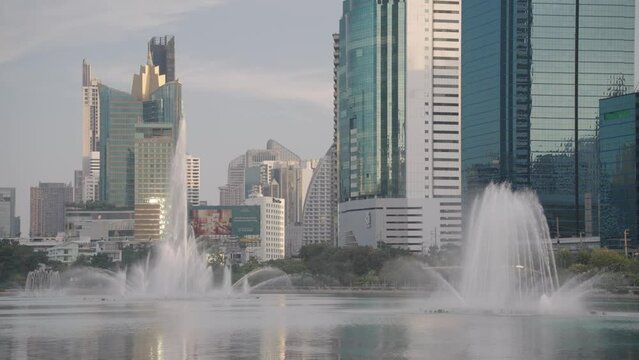 Water Fountain on Lake Ratchada of Benjakitti Benchakitti Park Bangkok Thailand Morning Sunrise Slow Motion