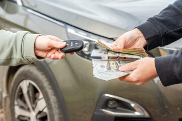 Exchange money and car keys. Insurance, loan concept. Deal of buying or renting car