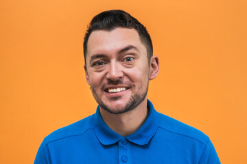 Portrait of the man on orange background. Man's emotions