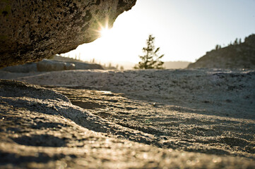 Sun sets over the granite landscape in Yosemite back country