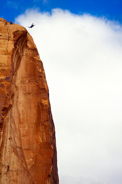 Basejumping off cliff in Moab, Utah, USA.
