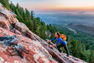 A Woman Is Climbing On The Second Flatiron Above Boulder, Colorado, Usa