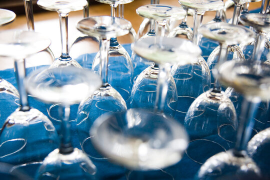 Rows of wine glasses at a wedding reception at the Olympic Park Institute in Olympic National Park, Washington.