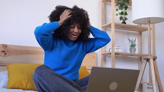 Smiling Black Woman Using Laptop Celebrating A Good New