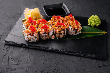 sushi rolls with salmon pieces and red caviar