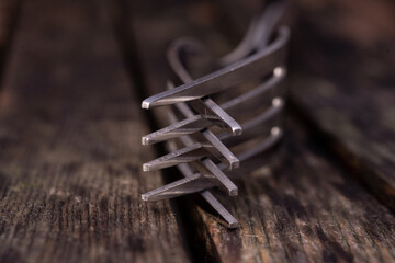 Two forks entwined on a rustic wooden table