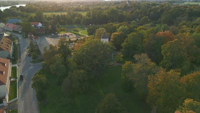 Village church In a park. Marvelous aerial view flight wide orbit overview drone
Paretz Brandenburg Havelland Germany summer evening 2022. High Quality 4k Cinematic footage