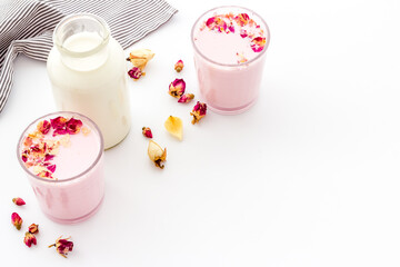 Fototapeta na wymiar Pink matcha latte coffee or tea with milk, top view