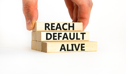 Reach default alive symbol. Concept words Reach default alive on wooden blocks on a beautiful white table white background. Businessman hand. Business, finacial and reach default alive concept.