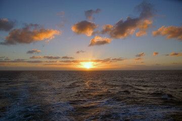 Obraz premium Magic of the Atlantic. Sunrise . Open ocean waves horizon and clouds. Bright colors. 
