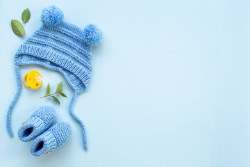 Baby infant hat with booties and kids accessories, flat lay