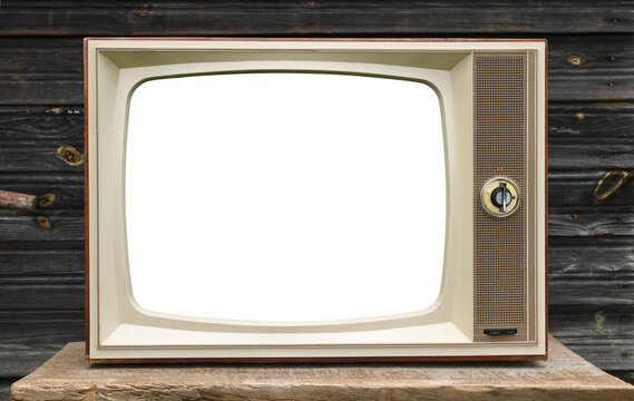 Old vintage TV with a white screen on a wooden wall background.
