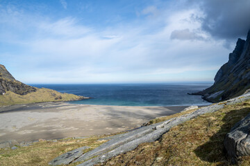 Views of Bunes beach in Lofoten, Norway, during spring on a clear sunny day with some clouds