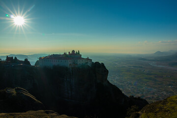 A monastery placed on top of a mountain in Greece.