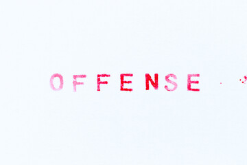 Red color ink rubber stamp in word offense on white paper background