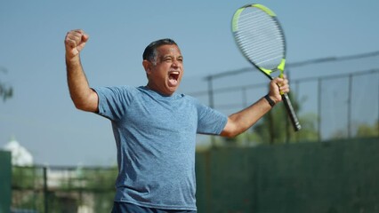 Angry frustrated senior men after losing the game while playing tennis at court - concept of competition, challenges and tournament