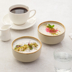 Side view on two different cereal porridge bowls