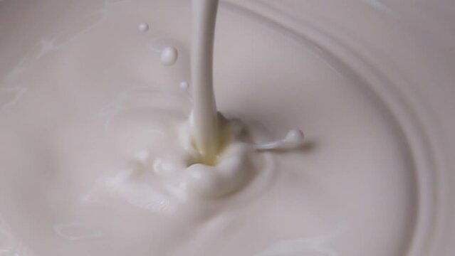 Pouring fresh milk in super slow motion