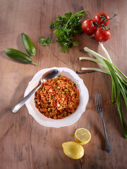 Traditional wheat salad and ingredients called kısır