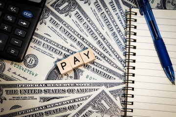 pay word, buness term,lettering word, money and pen and calculator