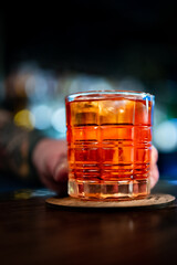 man hand bartender hold cocktail glass in bar