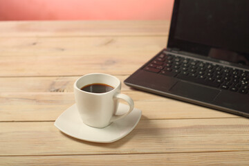 white cup with coffee on the table