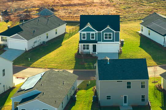 Aerial view of tightly packed homes in South Carolina residential area. New family houses as example of real estate development in american suburbs