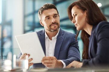 Tablet, meeting and teamwork of business people in office workplace. Collaboration, technology and...