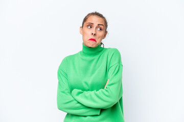 Obraz premium Young caucasian woman isolated on white background making doubts gesture while lifting the shoulders