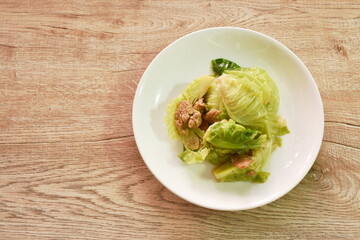 fried Brussels sprout with slice pork in oyster sauce on plate 