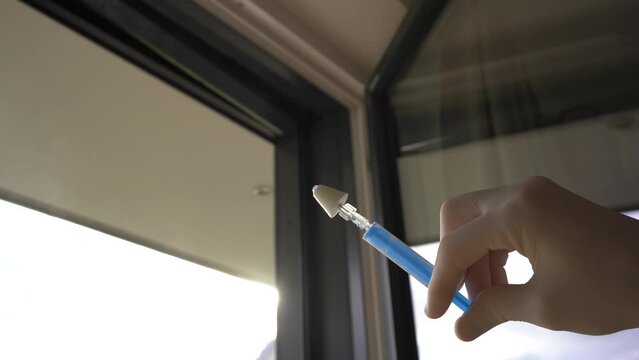 Nebulizing a drug for intranasal application with a mucosal atomization device on a syringe.