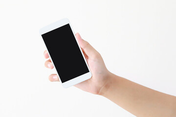 Hand holding blank screen phone or smartphone or tablet for template on white background.