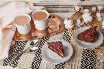 Obraz na płótnie Canvas Aesthetics St Valentines day breakfast with chocolate cherry cake pieces, coffee cups and cotton