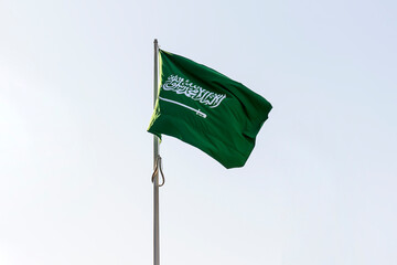 flag of Saudi Arabia against blue sky