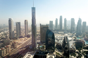 Fototapeta na wymiar Tall skyscrapers against the blue sky. Dubai.