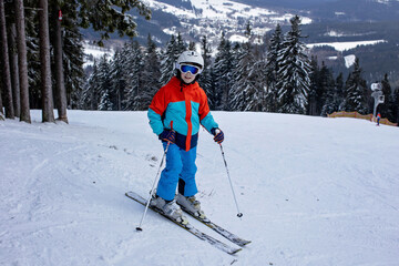 Fototapeta na wymiar Kids, happy children, skiing wintertime together, family holiday