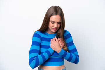 Young caucasian woman isolated on white background having a pain in the heart