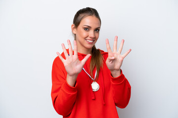 Young caucasian woman with medals isolated on white background counting nine with fingers