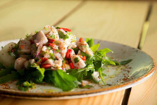 Calamari ceviche. The cebiche or ceviche is a dish consisting of fish marinated in citrus seasonings.