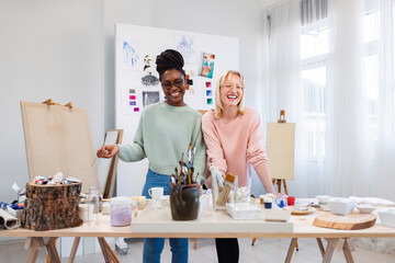 Young female artists are in their painting studio
