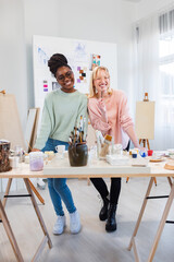 Young female artists are in their painting studio
