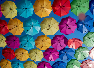 Fototapeta na wymiar Ciel de parapluies de toutes les couleurs, Gap, Hautes-Alpes, Provence-Alpes-Côte d’Azur