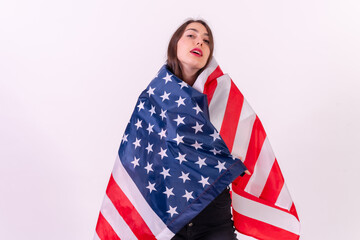 caucasian woman embracing usa flag isolated on a white background